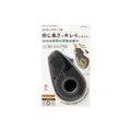 Quick 1495 dispenser tape cutter in its retail packaging, featuring a black plastic dispenser with a circular opening and Japanese text on a white card.