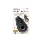 Quick 1495 dispenser tape cutter in its retail packaging, featuring a black plastic dispenser with a circular opening and Japanese text on a white card.