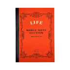 Red notebook with black decorative border and text on a white background