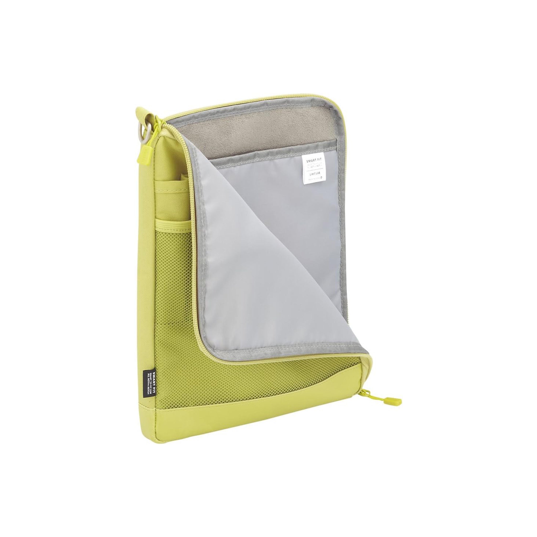 A lime green mesh tablet sleeve with a gray interior, shown open against a white background.