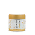 Matcha tea canister with gold lid on a white background