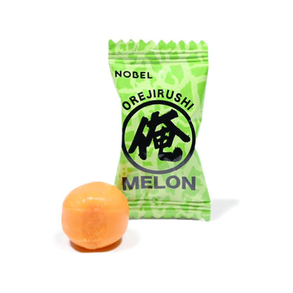 Green package of Nobel Orejirushi Melon with a melon candy next to it on a white background