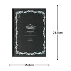 Black notebook with decorative border and measurements on a white background