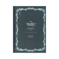 Black notebook with decorative border and 'Tomoe River' branding on a white background