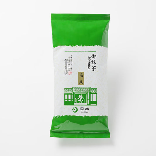Green package of matcha powder on a white background