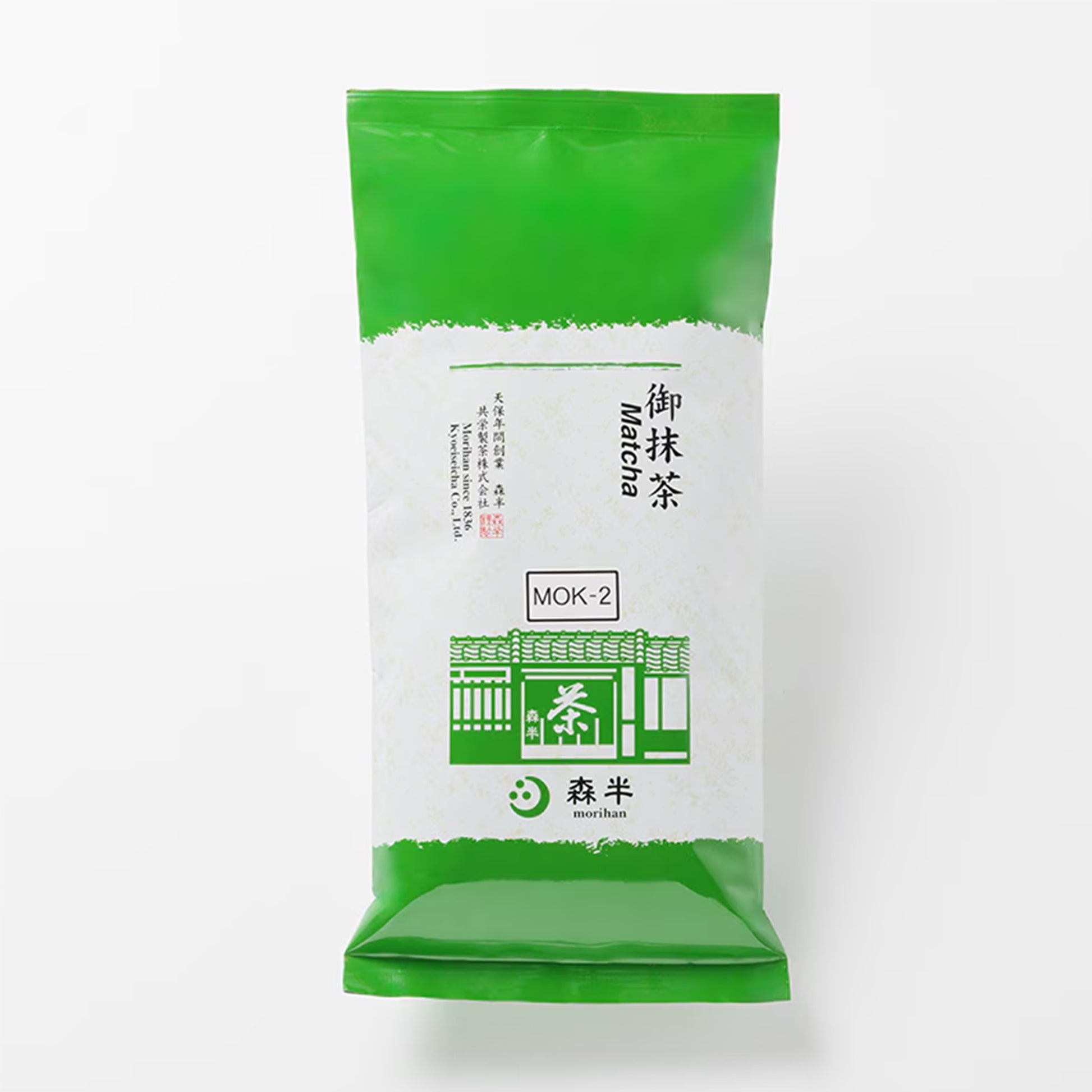 Green and white package of Mok-2 matcha powder on a white background
