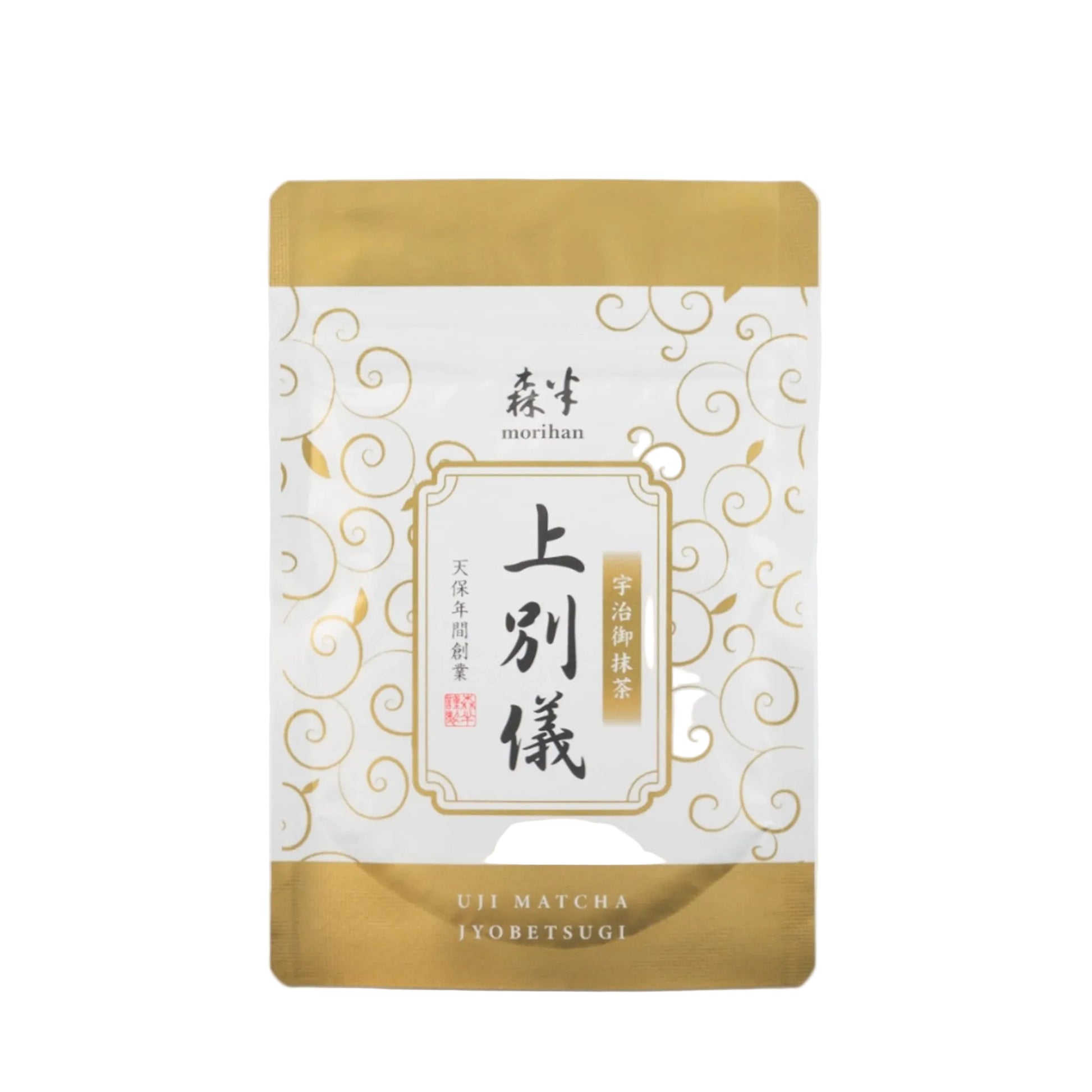 Tea package with gold and white design on a light gray background
