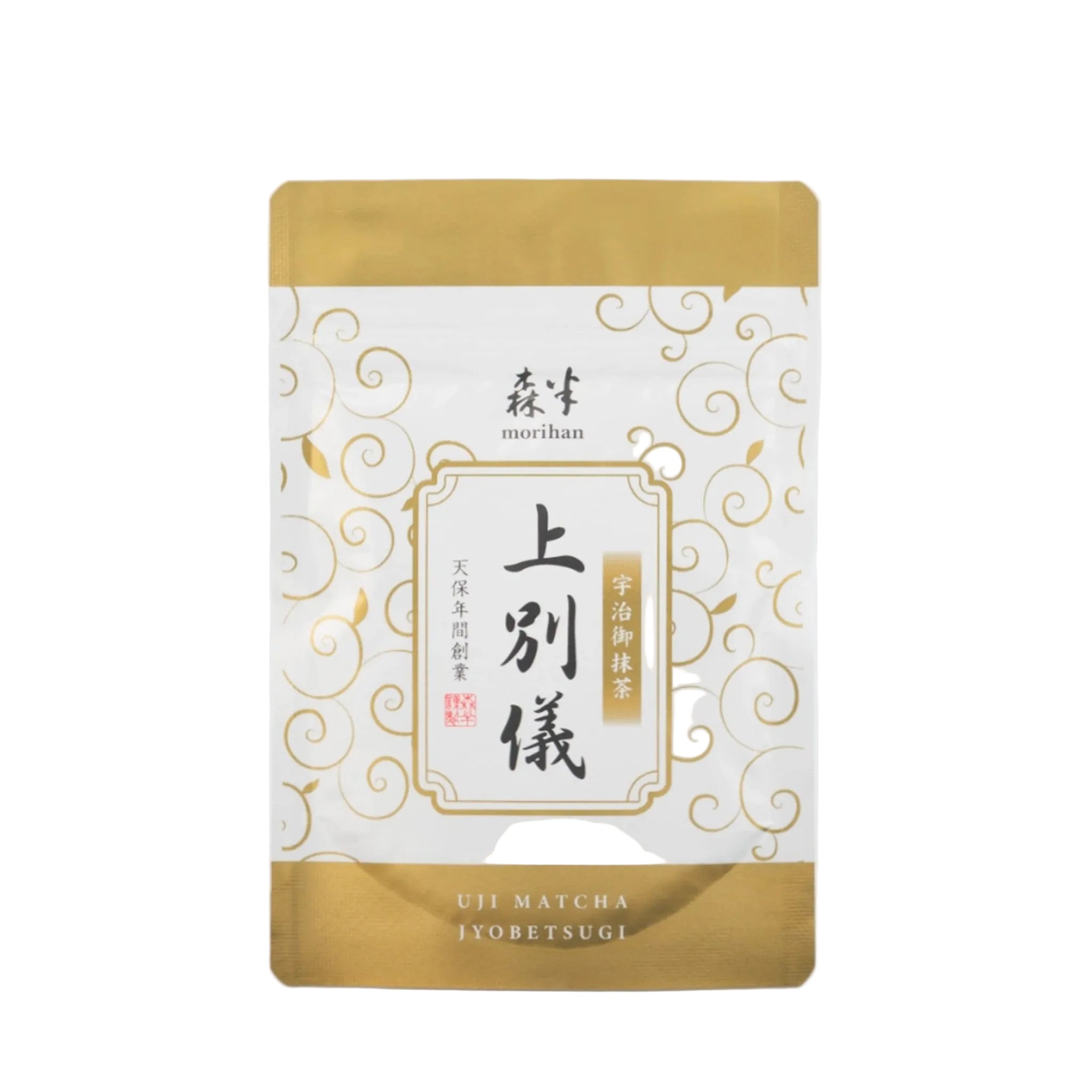 Tea package with gold and white design on a light gray background