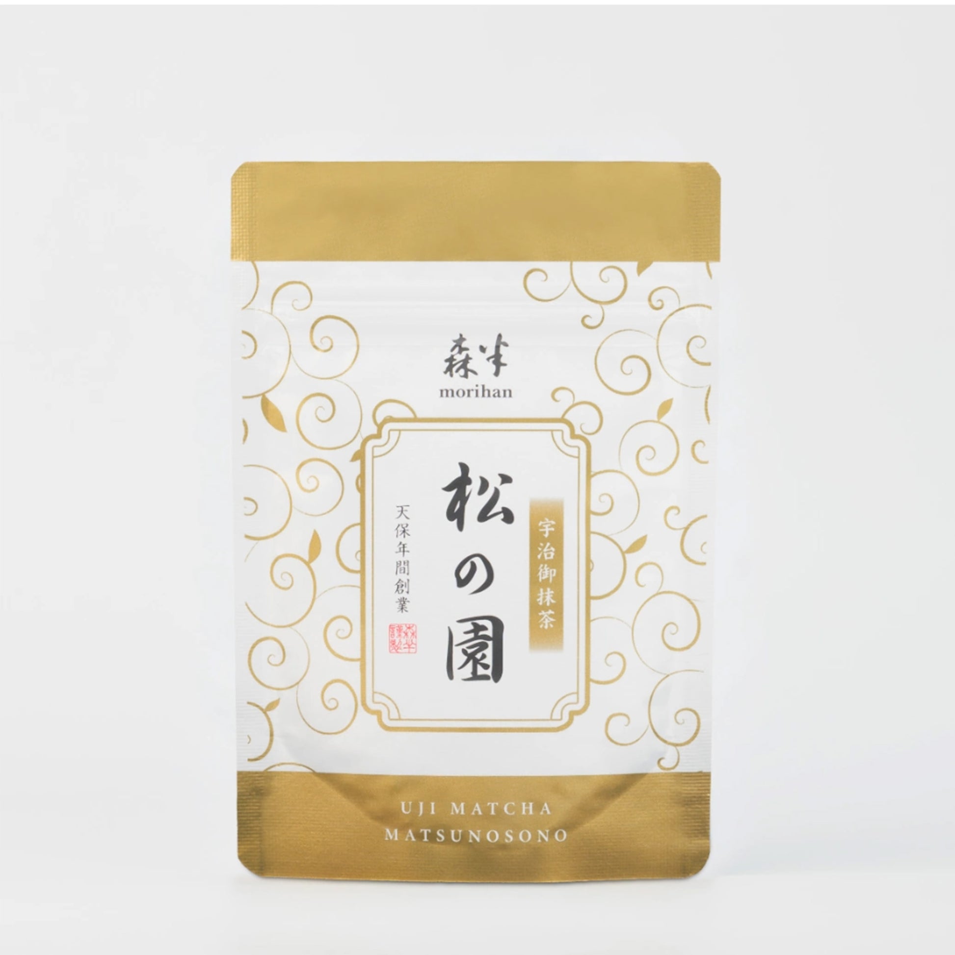 Matcha tea package with gold and white design on a white background